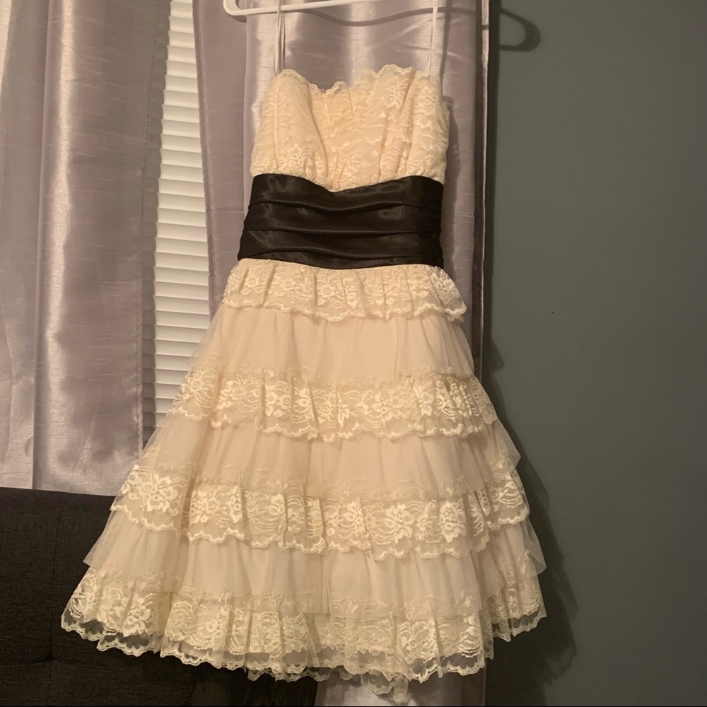 Cream colored dress size 9/10 by Masquerade. Worn once for homecoming Dance.